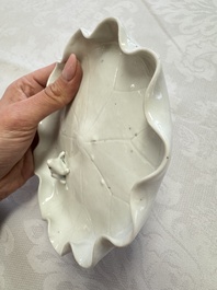 A Chinese Dehua blanc de Chine 'Lotus Leaf and Frog' brush washer on a wooden stand, Kangxi/Yongzheng