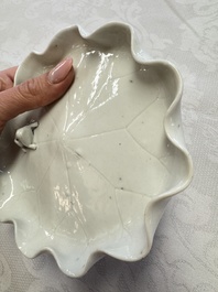 A Chinese Dehua blanc de Chine 'Lotus Leaf and Frog' brush washer on a wooden stand, Kangxi/Yongzheng
