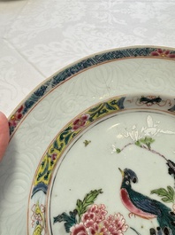 A pair of Chinese famille rose 'Peacock and Flowers' plates, Yongzheng
