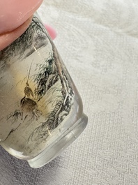 A Chinese inside-painted glass snuff bottle with two men wearing straw raincoats, dated 1911