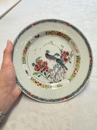 A pair of Chinese famille rose 'Peacock and Flowers' plates, Yongzheng