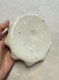 A Chinese Dehua blanc de Chine 'Lotus Leaf and Frog' brush washer on a wooden stand, Kangxi/Yongzheng