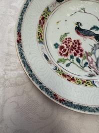 A pair of Chinese famille rose 'Peacock and Flowers' plates, Yongzheng