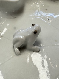 A Chinese Dehua blanc de Chine 'Lotus Leaf and Frog' brush washer on a wooden stand, Kangxi/Yongzheng