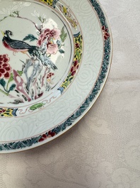 A pair of Chinese famille rose 'Peacock and Flowers' plates, Yongzheng