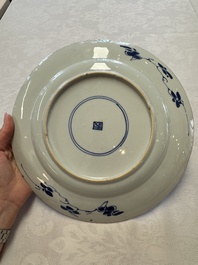 A Chinese blue and white dish with floral design and a famille rose 'HeHe Erxian' plate, Kangxi/Yongzheng