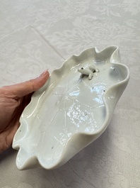 A Chinese Dehua blanc de Chine 'Lotus Leaf and Frog' brush washer on a wooden stand, Kangxi/Yongzheng