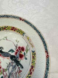 A pair of Chinese famille rose 'Peacock and Flowers' plates, Yongzheng