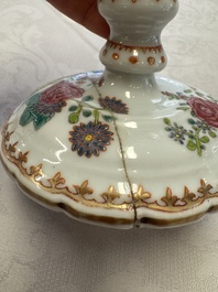A pair of Chinese famille rose candlesticks with floral design, Qianlong
