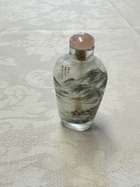 A Chinese inside-painted glass snuff bottle with two men wearing straw raincoats, dated 1911