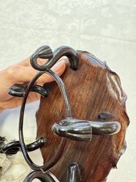 A Chinese Dehua blanc de Chine 'Lotus Leaf and Frog' brush washer on a wooden stand, Kangxi/Yongzheng