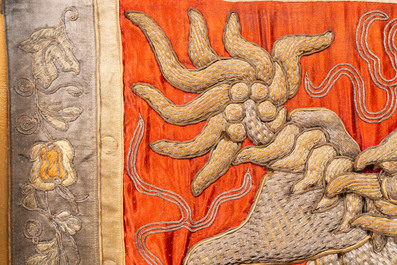 Two Chinese gold and silver-thread-embroidered silk panels with Buddhist lions and Guandi, 19th C.