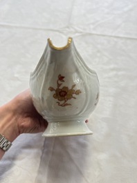 A Chinese armorial plate, a serving dish and a sauce boat with the arms of de Heere for the Dutch market, Qianlong, ca. 1735-1765