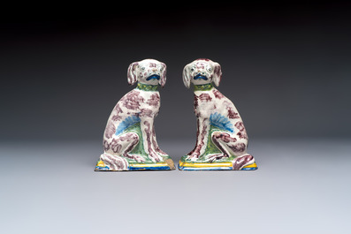 A pair of polychrome Dutch Delft money banks modelled as dogs, 18th C.