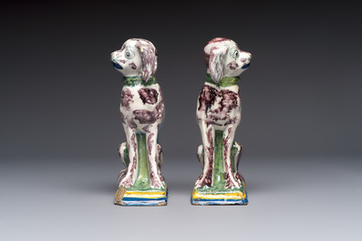 A pair of polychrome Dutch Delft money banks modelled as dogs, 18th C.