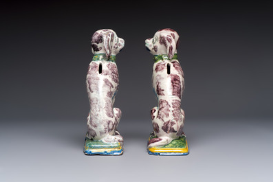 A pair of polychrome Dutch Delft money banks modelled as dogs, 18th C.