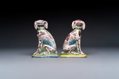 A pair of polychrome Dutch Delft money banks modelled as dogs, 18th C.