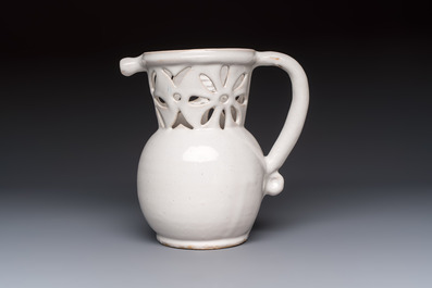 A French white-glazed puzzle jug, Nevers, 18th C.