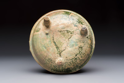 A Chinese green-glazed pottery ritual tripod food vessel with handles, 'Ding 鼎', Han