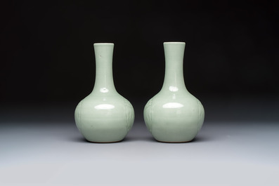 A pair of Chinese celadon-glazed bottle vases with incised phoenix design, Yongzheng mark, 19th C.