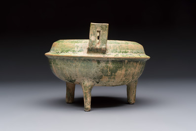 A Chinese green-glazed pottery ritual tripod food vessel with handles, 'Ding 鼎', Han