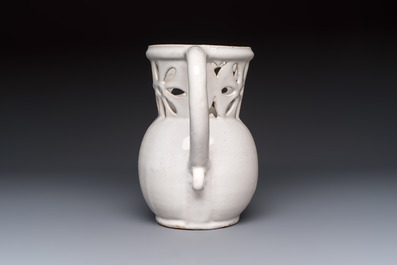 A French white-glazed puzzle jug, Nevers, 18th C.