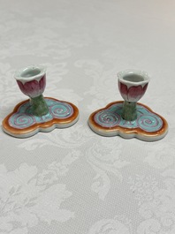 A pair of Chinese export famille rose lotus-form chambersticks on ruyi-shaped bases, Qianlong