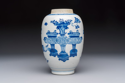 A Chinese blue and white ovoid 'Antiquities' jar with a wooden cover, Kangxi