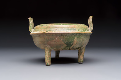 A Chinese green-glazed pottery ritual tripod food vessel with handles, 'Ding 鼎', Han