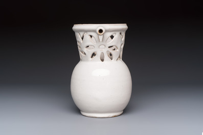 A French white-glazed puzzle jug, Nevers, 18th C.