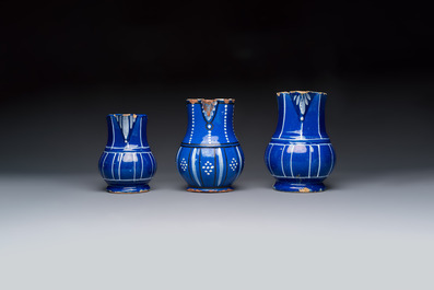 Three blue-ground faience jugs, probably Saint-Omer, North of France, 18/19th C.