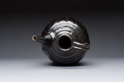A Chinese Yaozhou black-glazed ewer with a ribbed body, Song