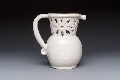 A French white-glazed puzzle jug, Nevers, 18th C.