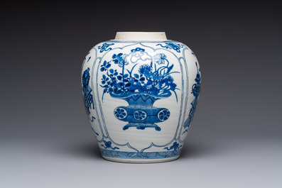 A Chinese blue and white 'Antiquities and Flower Baskets' vase with a wooden cover, Kangxi