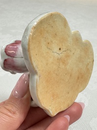 A pair of Chinese export famille rose lotus-form chambersticks on ruyi-shaped bases, Qianlong