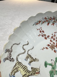 A Chinese famille verte Kakiemon-style 'Boy and Tigers' lobed dish, Kangxi