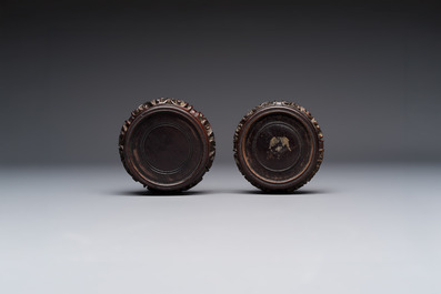 A pair of Chinese blue and white 'Buddhist Lions' triple gourd vases on reticulated wooden stands, 19th C.