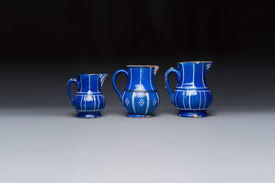 Three blue-ground faience jugs, probably Saint-Omer, North of France, 18/19th C.