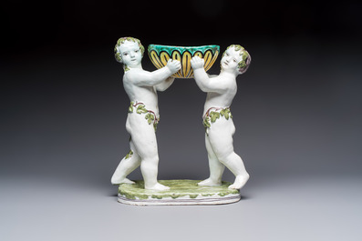 A French polychrome faience group with two Bacchus figures, Geo Martel, D&egrave;svres, early 20th C.