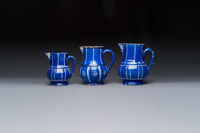 Three blue-ground faience jugs, probably Saint-Omer, North of France, 18/19th C.