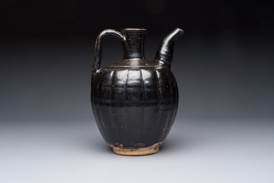 A Chinese Yaozhou black-glazed ewer with a ribbed body, Song