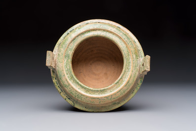A Chinese green-glazed pottery ritual tripod food vessel with handles, 'Ding 鼎', Han