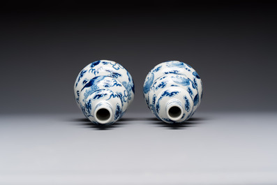 A pair of Chinese blue and white 'Buddhist Lions' triple gourd vases on reticulated wooden stands, 19th C.