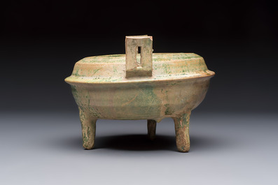 A Chinese green-glazed pottery ritual tripod food vessel with handles, 'Ding 鼎', Han