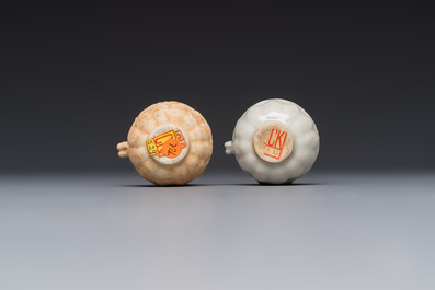 A pair of Chinese bird feeders with moulded design, one unglazed, on later wooden stands, Song