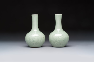 A pair of Chinese celadon-glazed bottle vases with incised phoenix design, Yongzheng mark, 19th C.