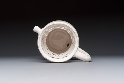 A French white-glazed puzzle jug, Nevers, 18th C.