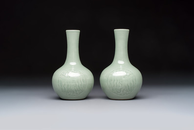 A pair of Chinese celadon-glazed bottle vases with incised phoenix design, Yongzheng mark, 19th C.