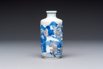 A Chinese blue, white and copper-red snuff bottle with narrative design, 19th C.