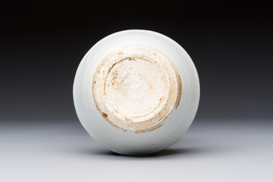 A Chinese white-glazed cup on a wooden stand, 17th C.